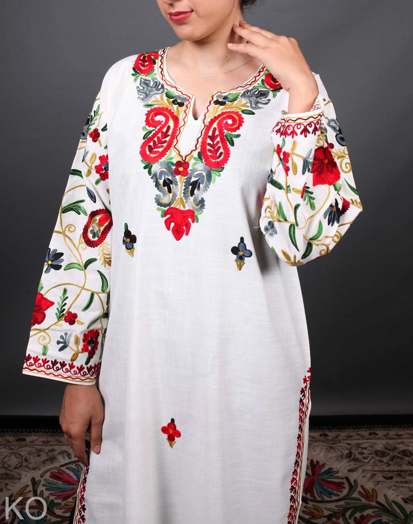 Multicolored Arm Design Aari Embroidered White Cotton Kurti